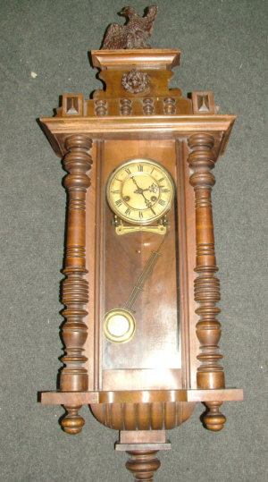 Appraisal: An early th century wooden cased Vienna regulator type wall