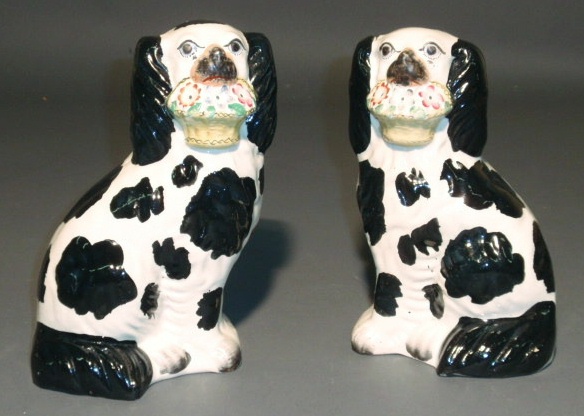 Appraisal: Pair of Staffordshire spaniels c black and white h x