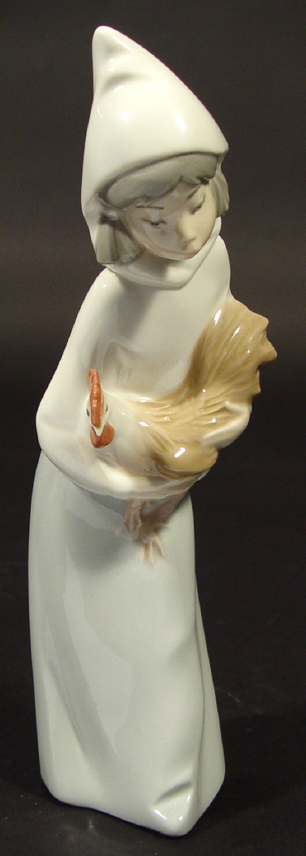 Appraisal: Lladro porcelain shepherdess clutching a cockerel with hand painted decoration