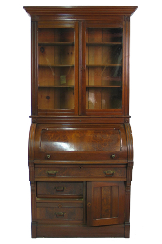 Appraisal: A VICTORIAN WALNUT CYLINDER-FRONT SECRETARY BOOKCASE American Civil War era