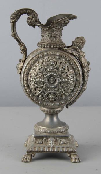 Appraisal: Ornate Metal Urn Very ornate metal urn with figural angel