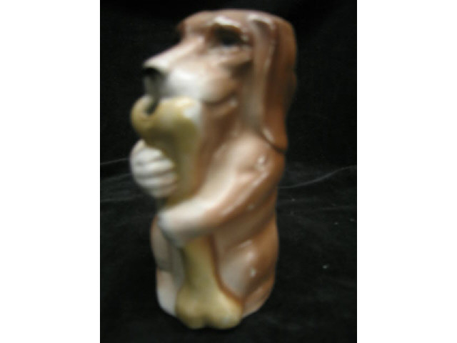 Appraisal: German Porcelain Figural Creamer of Dog with bone