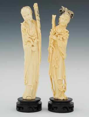 Appraisal: A Pair of Carved Ivory Attendants With Blossoms Standing figures