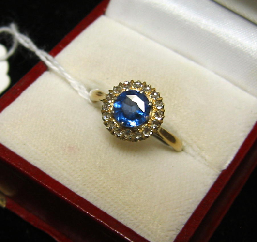 Appraisal: SAPPHIRE DIAMOND AND EIGHTEEN KARAT GOLD RING centering a round