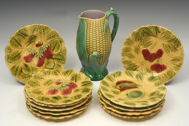 Appraisal: A SET OF ELEVEN FRENCH SARREGUEMINES POTTERY DESSERT PLATES decorated