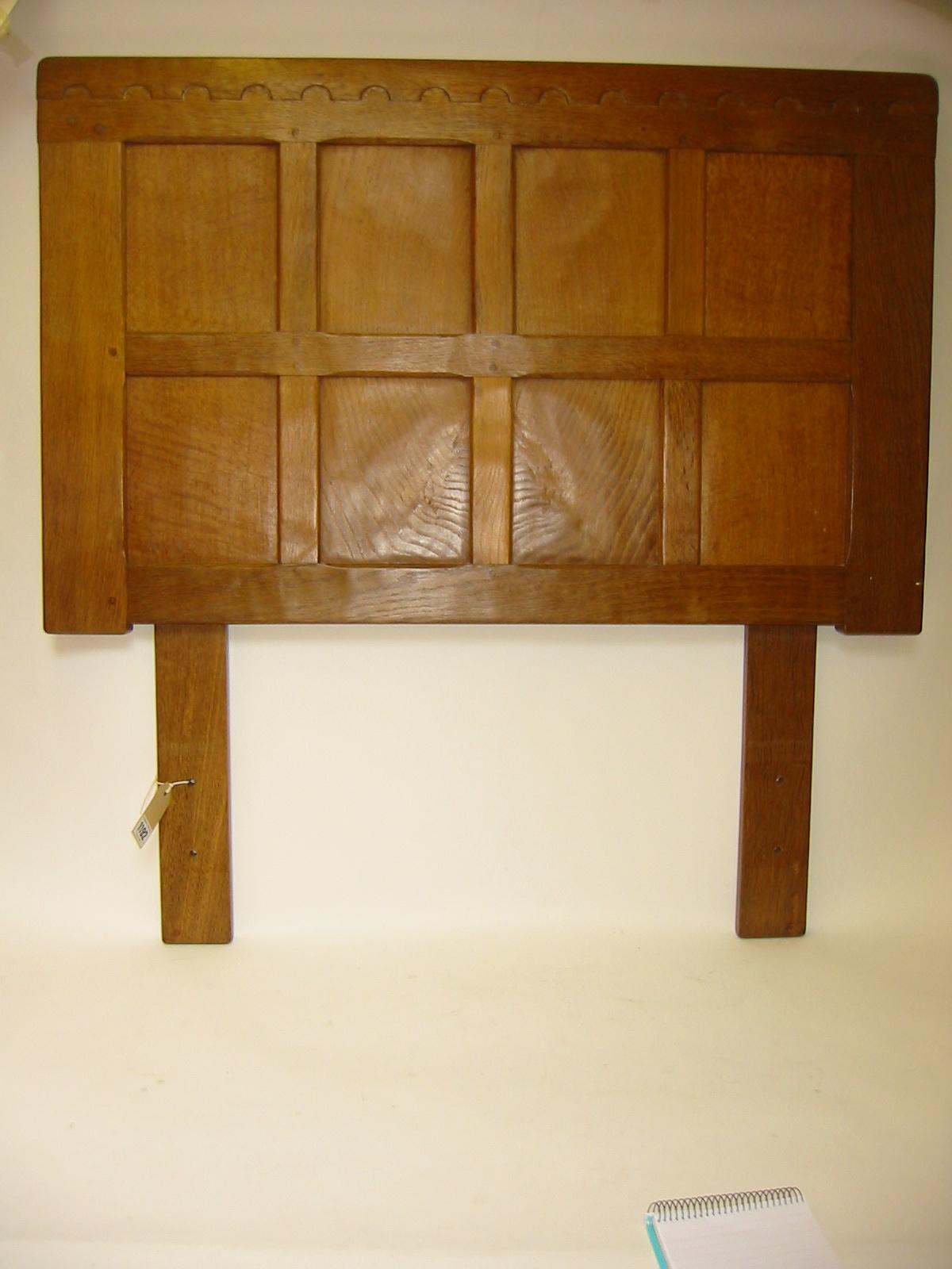 Appraisal: AN ADZED OAK SINGLE BEDSTEAD by Robert Mouseman Thompson the