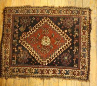 Appraisal: Persian Bag Face Rug The central medallion on indigo field