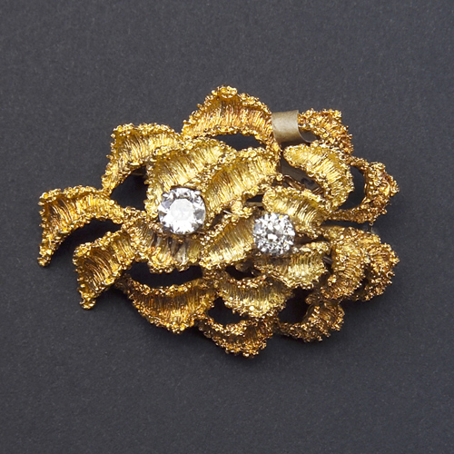 Appraisal: Substantial k yellow gold and diamond brooch free-form ribbon x