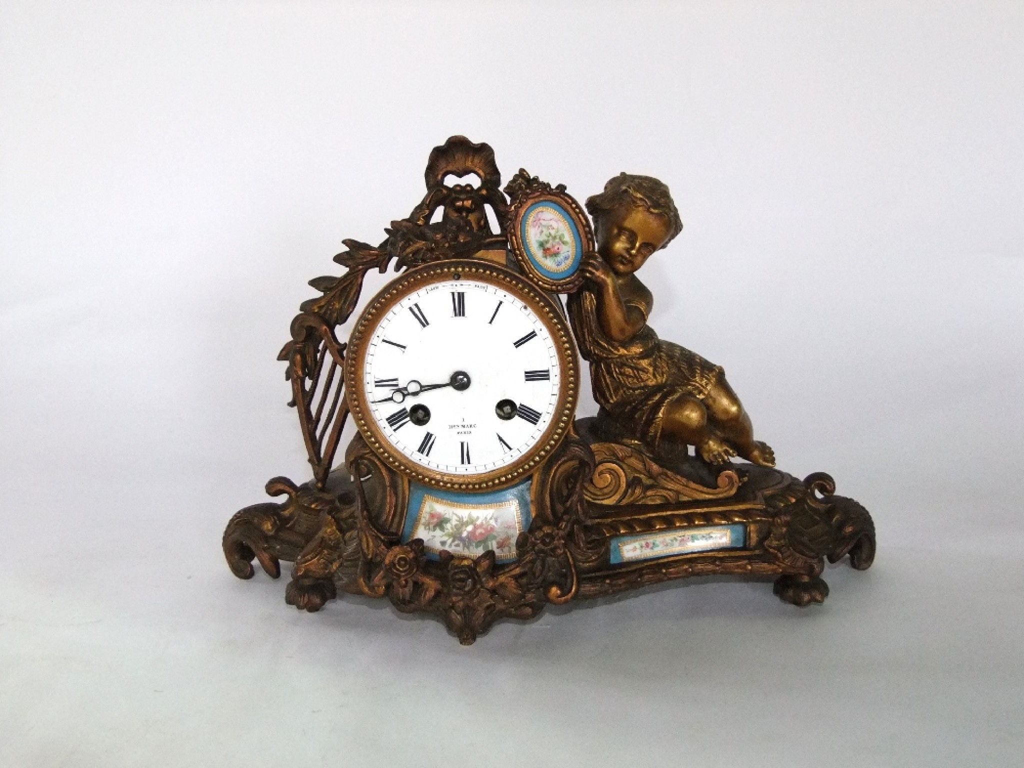 Appraisal: A th century gilded brass mantle clock with day striking