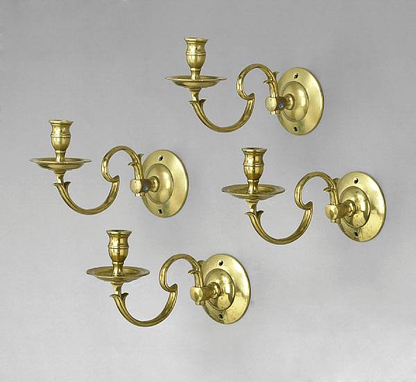 Appraisal: A set of four George III brass wall lights second