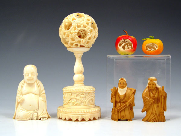 Appraisal: PIECE CARVED IVORY COLLECTION To include Pair of figures with