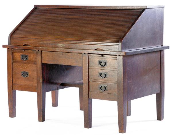 Appraisal: GUSTAV STICKLEY Roll-top desk no with six desk drawers and