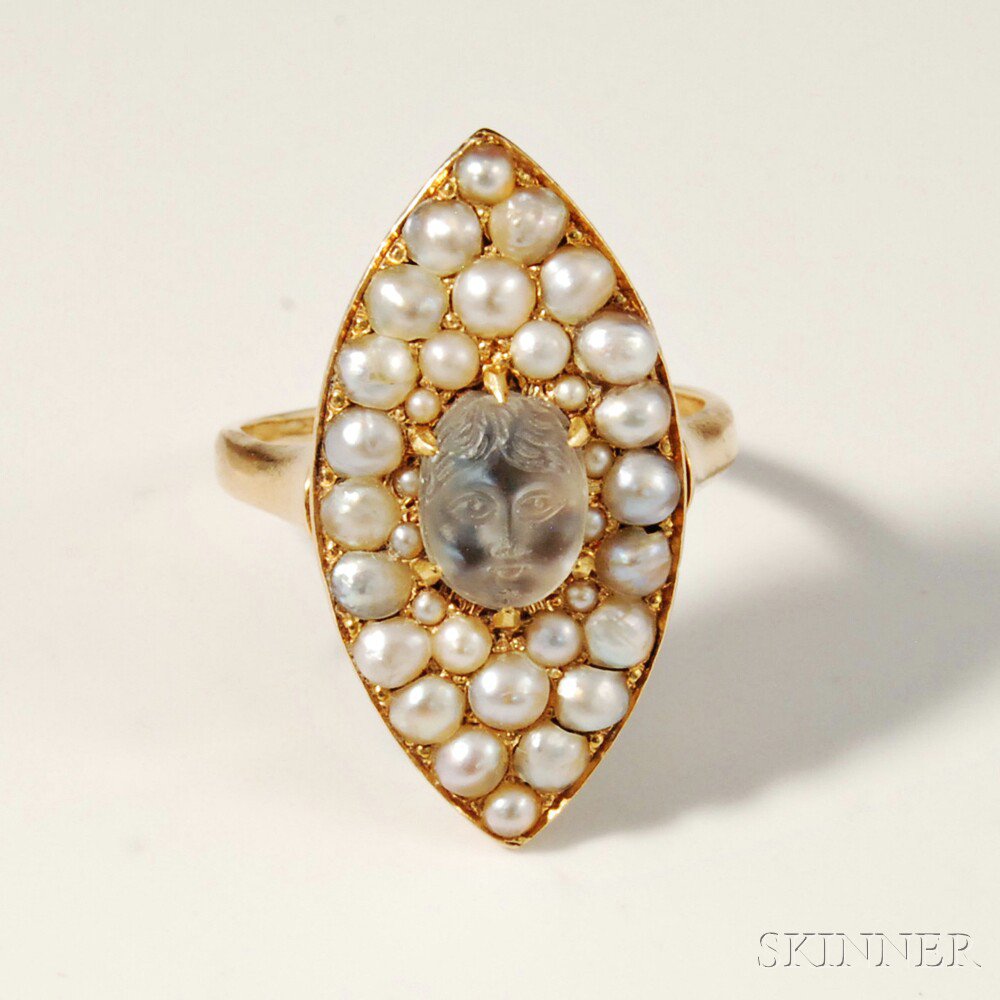 Appraisal: kt Gold Carved Moonstone and Pearl Ring the central stone