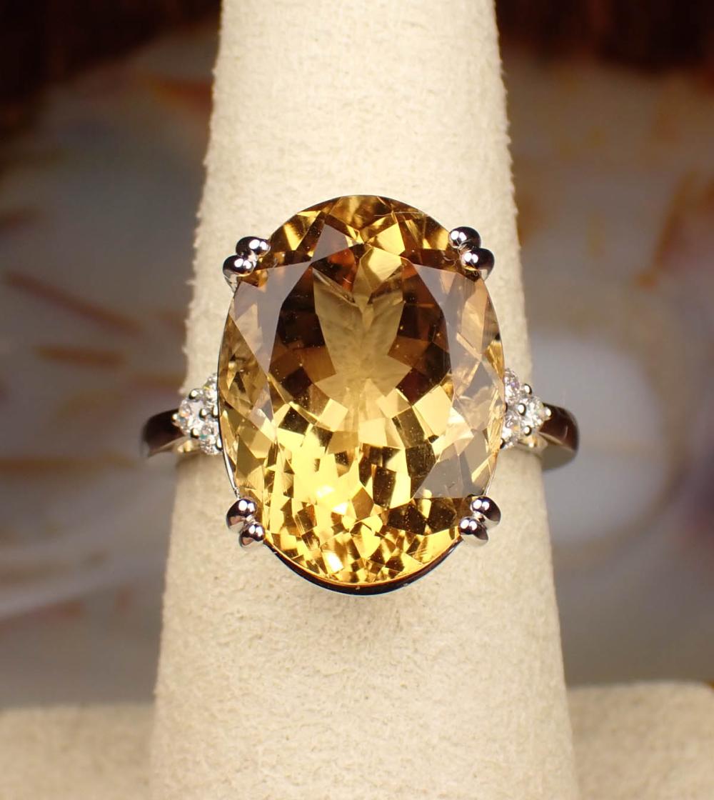 Appraisal: CITRINE DIAMOND AND FOURTEEN KARAT GOLD RING The white gold