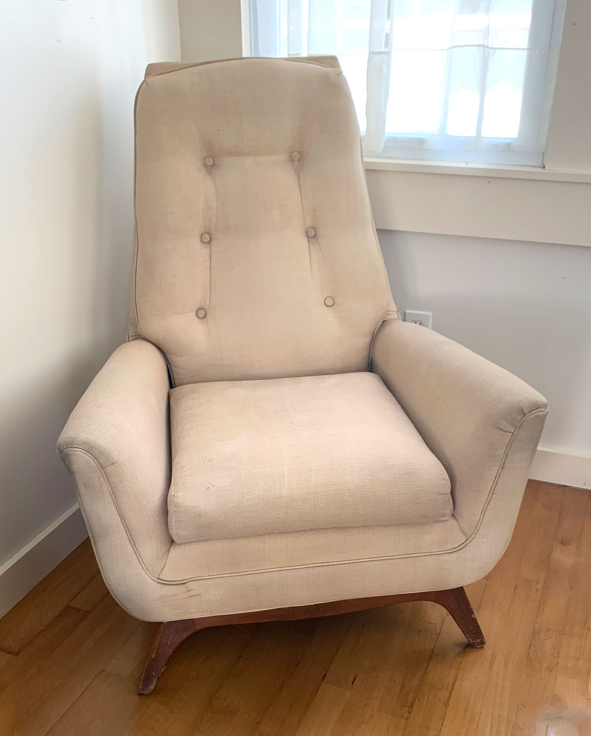 Appraisal: MID-CENTURY ARMCHAIR Off-white upholstered mid-century armchair Raised on square feet