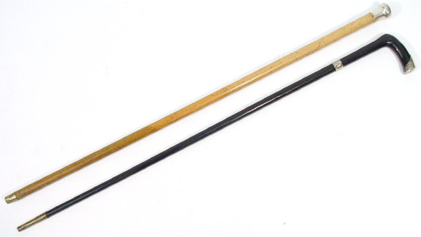 Appraisal: Victorian ebonised walking stick with chased silver mount together with