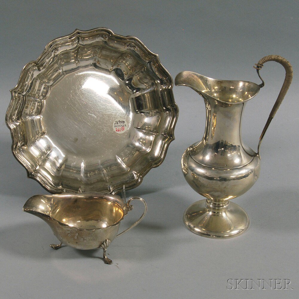 Appraisal: Three Pieces of Sterling Silver Tableware an English ewer with