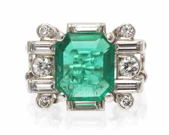 Appraisal: A Platinum Emerald and Diamond Ring in an intricate double