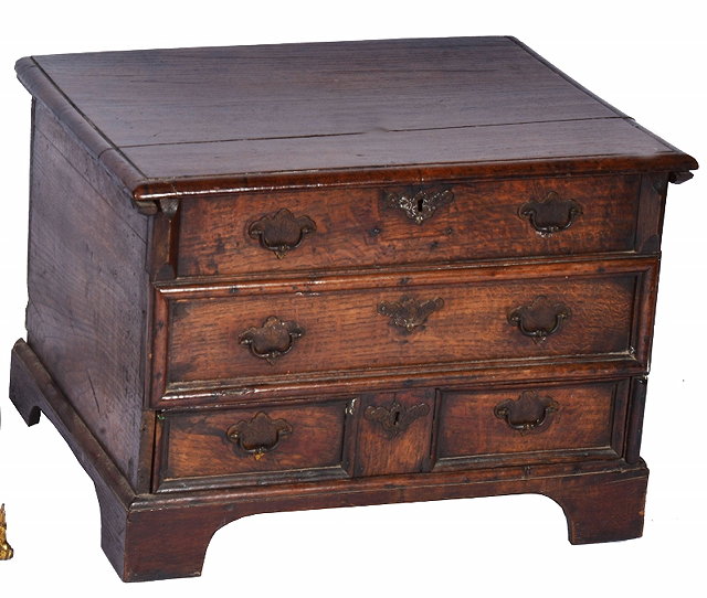 Appraisal: A SMALL ANTIQUE OAK CHEST with hinged top over two