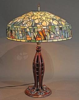 Appraisal: Tiffany style patinated bronze and leaded glass table lamp Tiffany