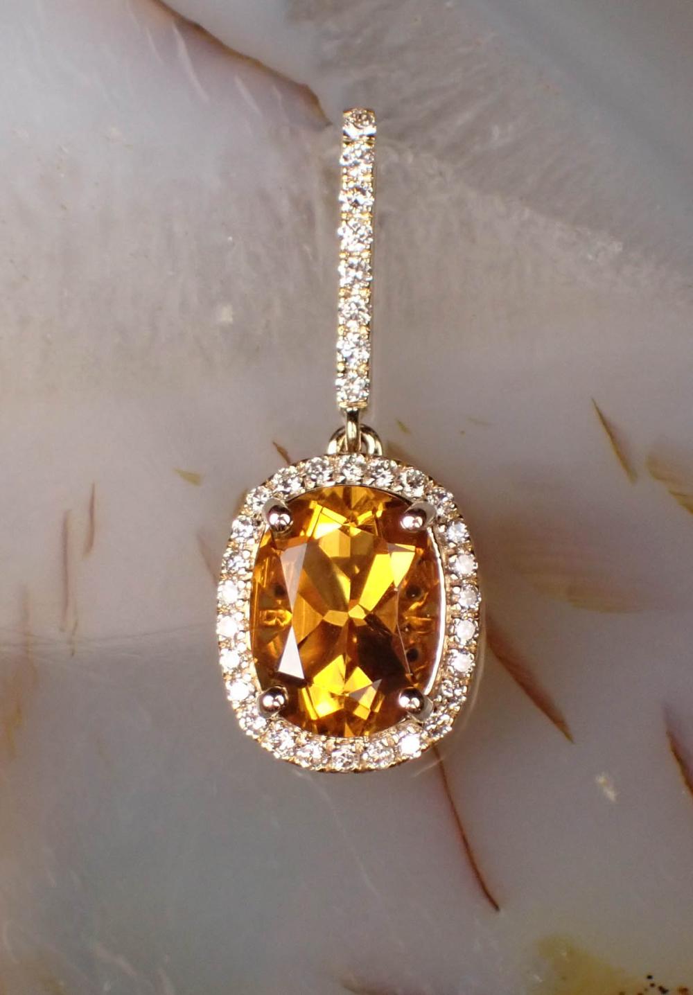 Appraisal: CITRINE DIAMOND AND FOURTEEN KARAT GOLD PENDANT The yellow gold