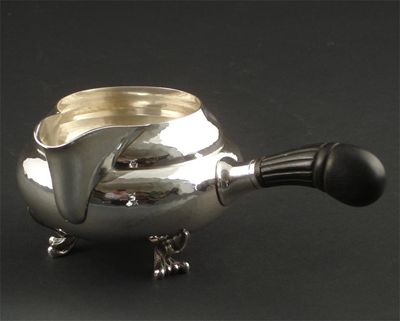 Appraisal: A Georg Jensen silver and ebonised wood sauce boat model