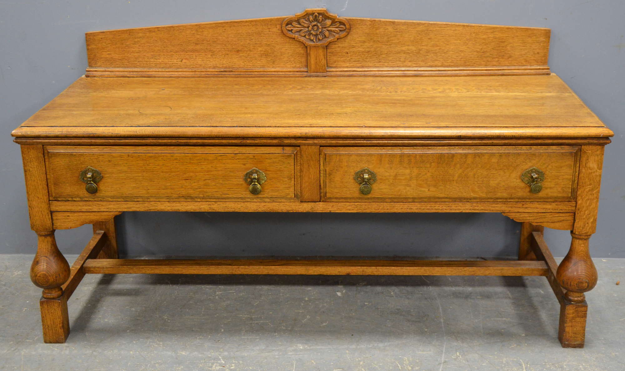 Appraisal: A low oak two drawer table with stretchered support