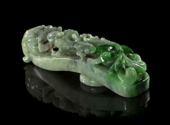 Appraisal: A Jadeite Belt Hook of a variegated green stone having