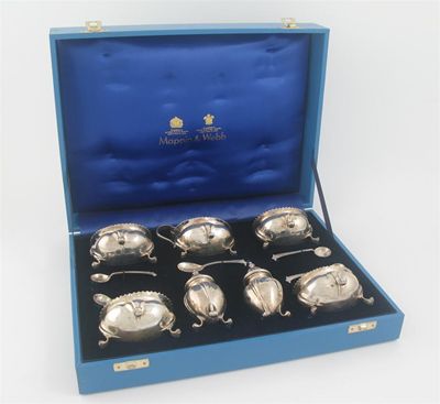 Appraisal: An Edwardian cased seven-piece condiment set comprising a mustard and