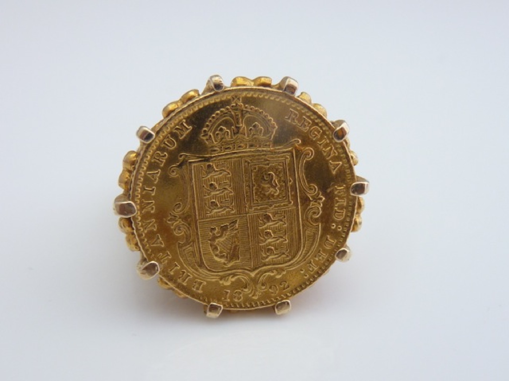 Appraisal: A half sovereign ring mounted in ct gold with pierced