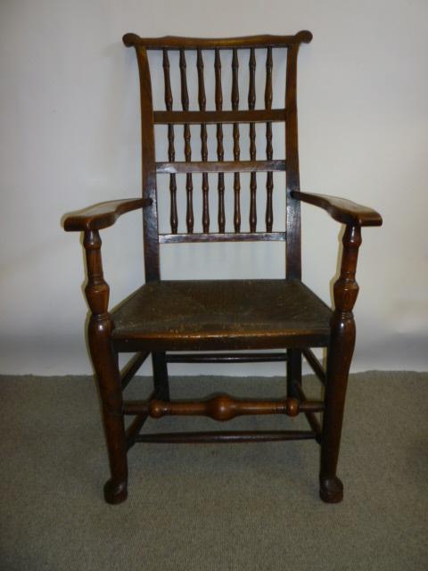 Appraisal: AN EARRED ASH AND ELM SPINDLE BACK ARM CHAIR Lancashire