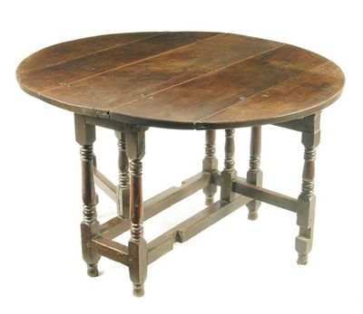 Appraisal: An th century gateleg table the twin flap oval top