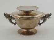 Appraisal: A covered bowl with everted rim and dolphin handles the