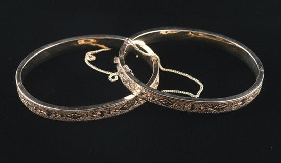 Appraisal: PAIR VICTORIAN K YELLOW GOLD BANGLE BRACELETS Engraved oval bangles