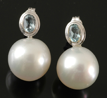 Appraisal: A pair of South Sea pearl and topaz earrings The