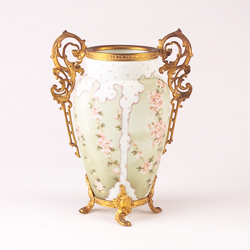 Appraisal: WAVECREST Enameled glass vase with gilt metal mounts painted with