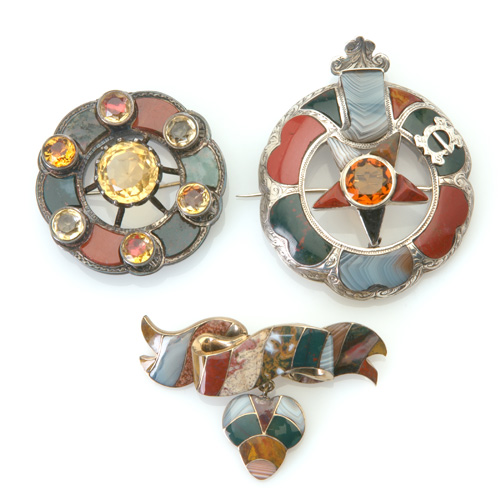 Appraisal: Three Victorian agate pebble brooches in gold or silver gold