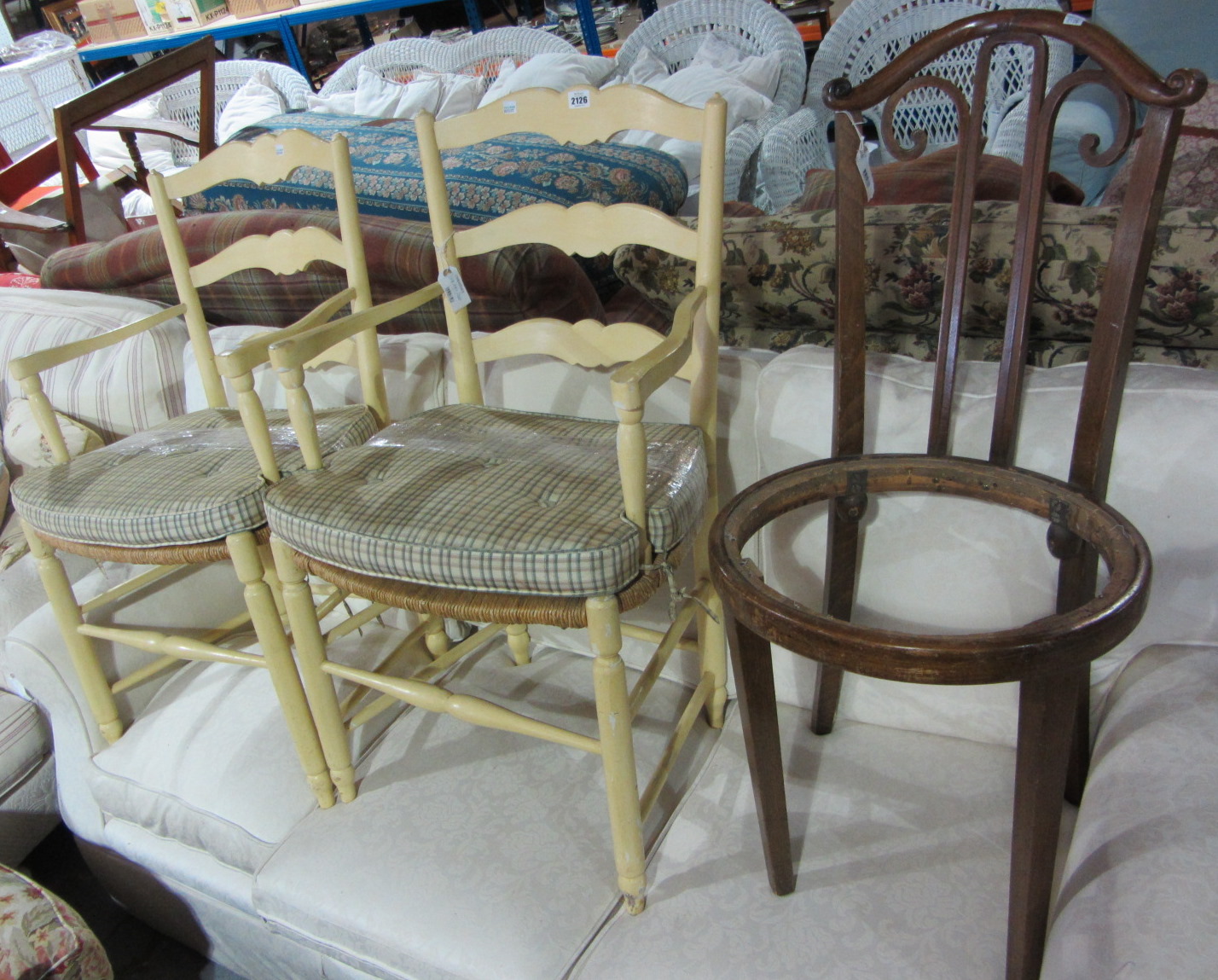 Appraisal: A pair of yellow painted open ladder back armchairs and