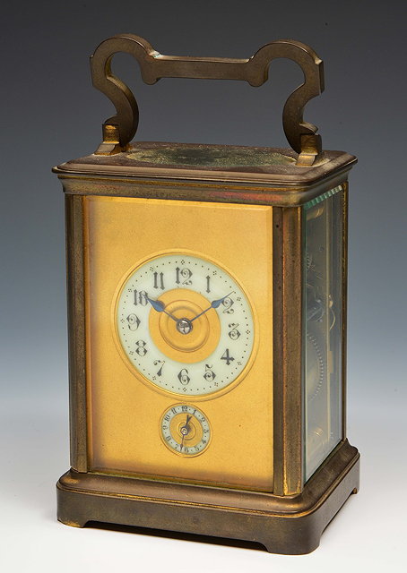 Appraisal: A French carriage clockthe gilt dial with Gothic enamel chapter