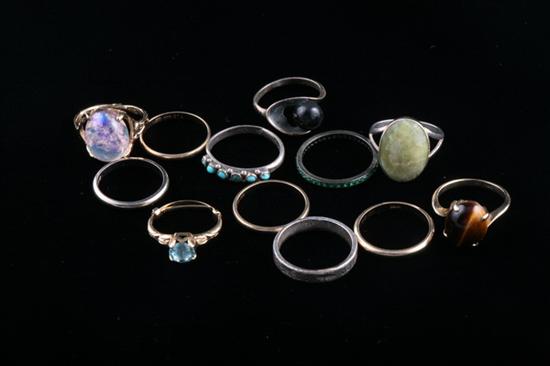 Appraisal: TWELVE ASSORTED GOLD AND SILVER RINGS Including three k yellow