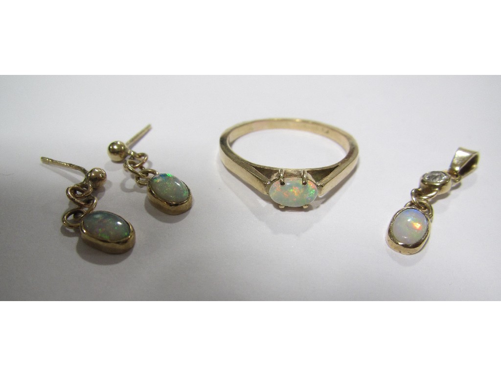 Appraisal: Gold opal and diamond set pendant with a similar pair