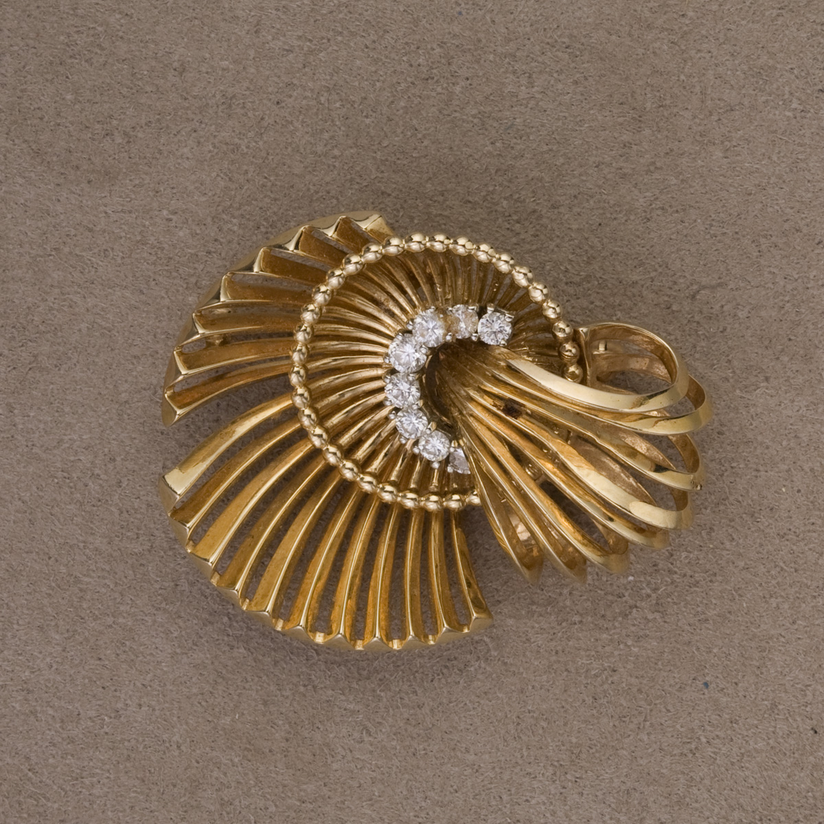 Appraisal: GOLD AND DIAMOND BROOCH The kt abstract form brooch set