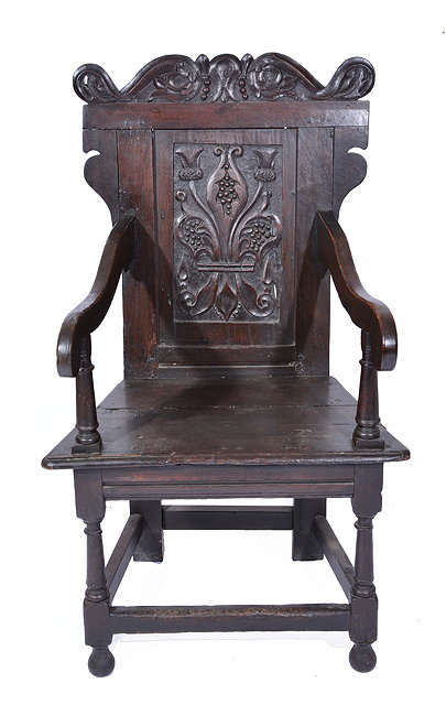 Appraisal: A TH CENTURY STYLE OAK OPEN ARMCHAIR with scroll carved