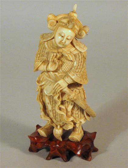 Appraisal: Chinese elephant ivory guardian figure Single section carving over wood