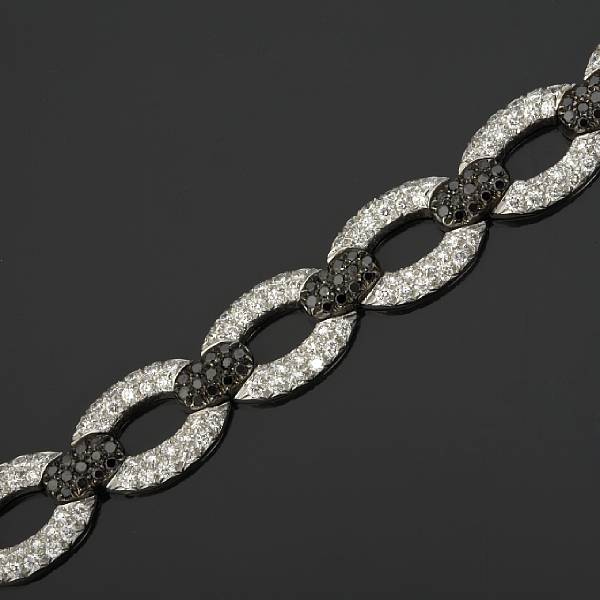 Appraisal: A black diamond and diamond link bracelet estimated total diamond