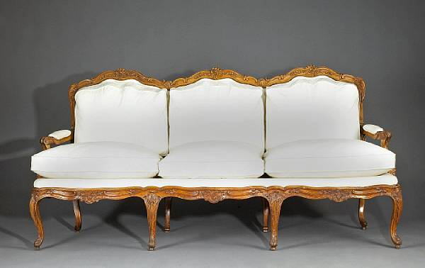 Appraisal: An Italian Rococo walnut settee mid th century The triple