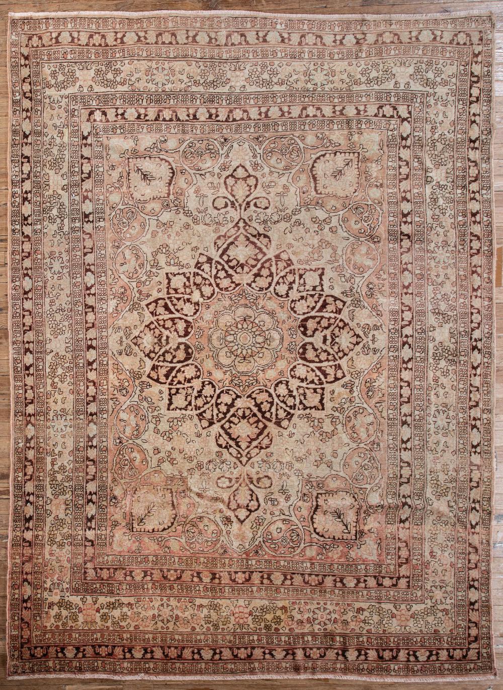 Appraisal: Persian Carpet beige and pink ground central medallion ft in