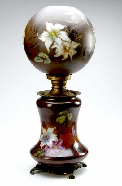 Appraisal: PAINTED GLASS OIL LAMP Painted with clematis on a brown