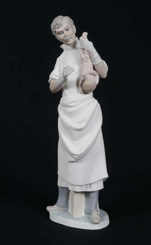 Appraisal: LLADRO PORCELAIN FIGURINE Obstetrician Salvador Furio sculptor issued retired Matte