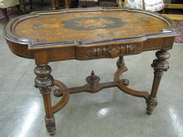 Appraisal: Renaissance Revival Marquetry Center Table with musical motif inlaid medallion